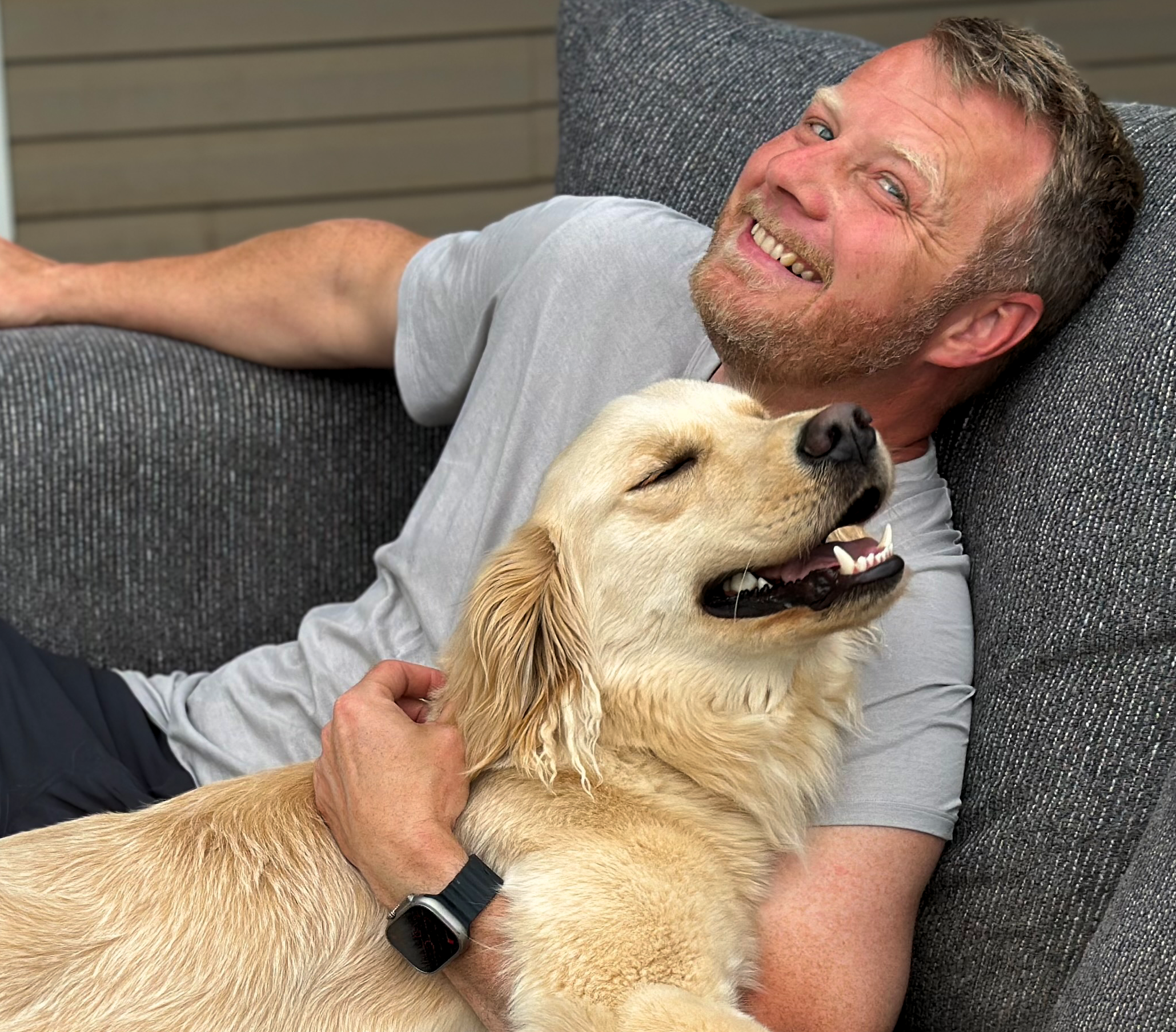 Mark relaxing with his dog Ollie